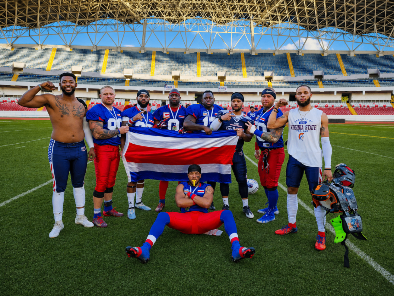 Costa Rica Sharks players holding the Costa Rican flag at the National Stadium