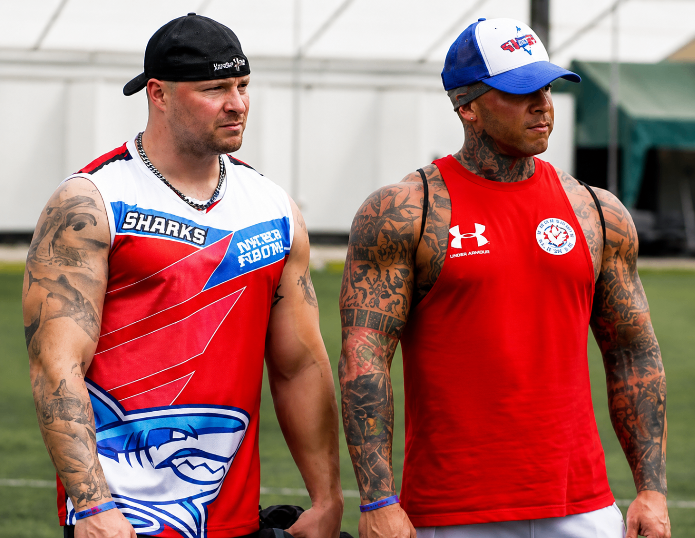 Two Costa Rica Sharks leaders watching the team from the sideline