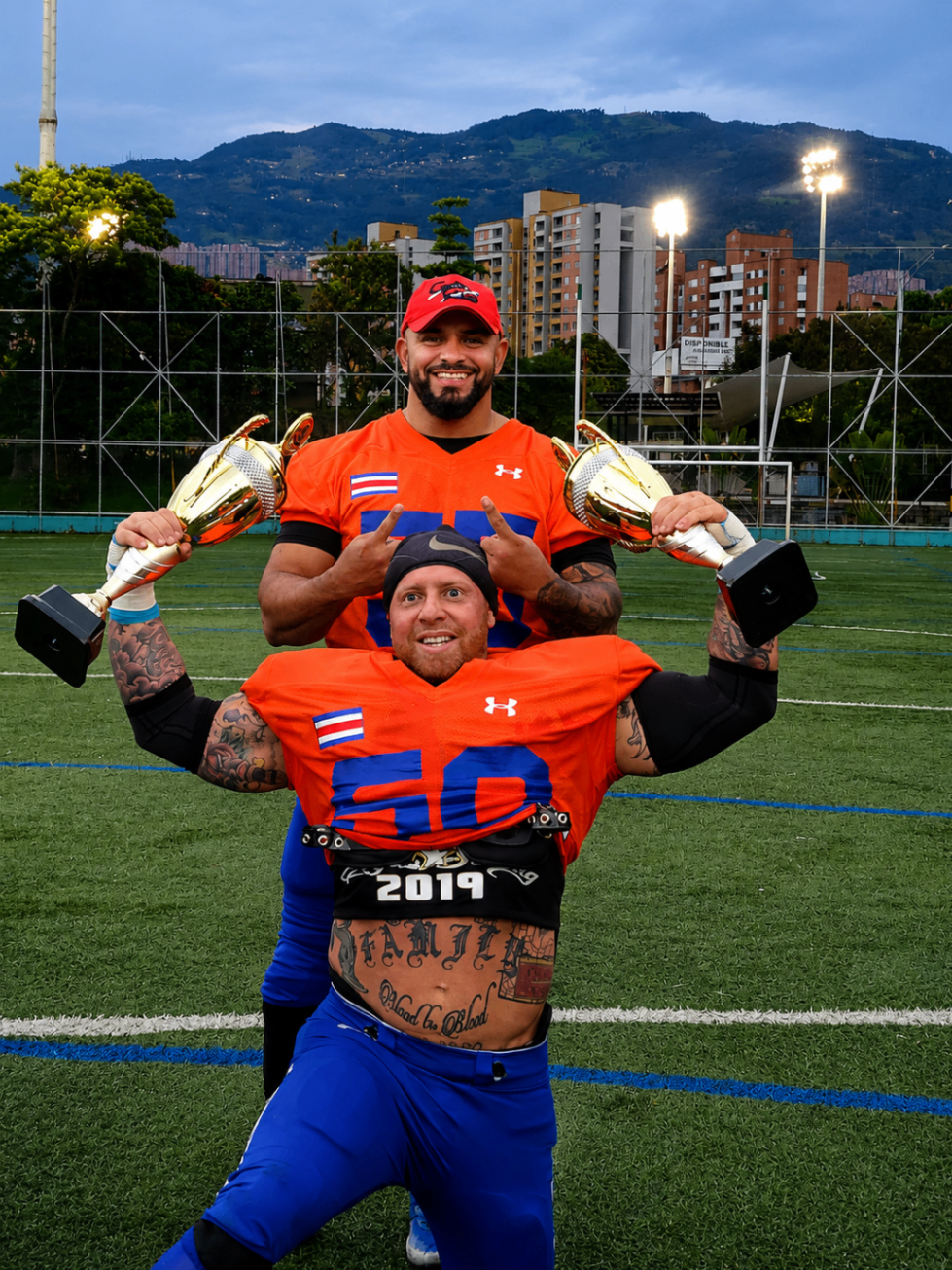 Costa Rica Sharks players celebrating with championship trophies