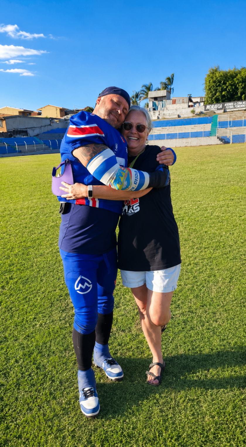 Ian embracing a Sharks supporter on the field